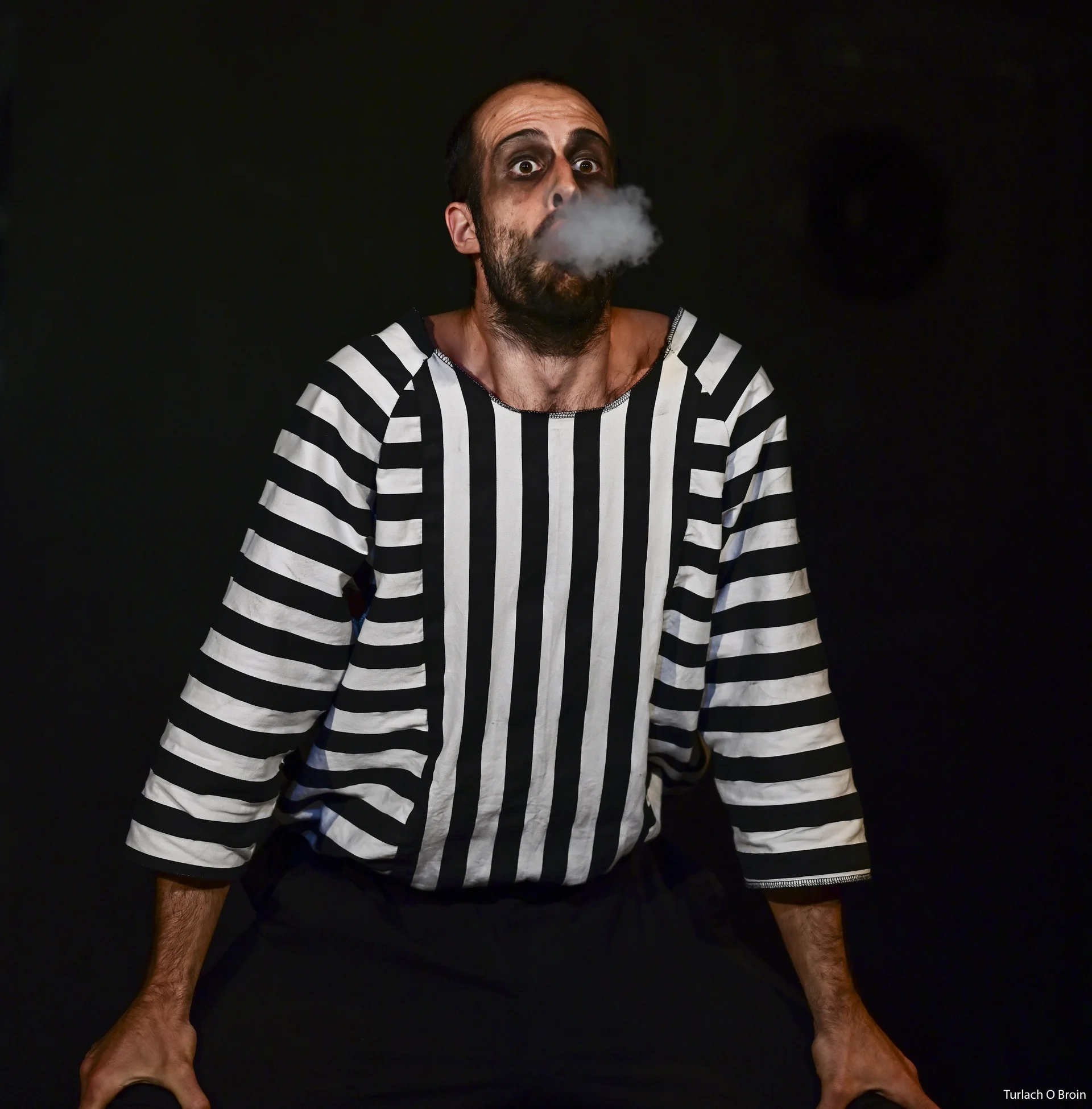 Mime blowing out smoke